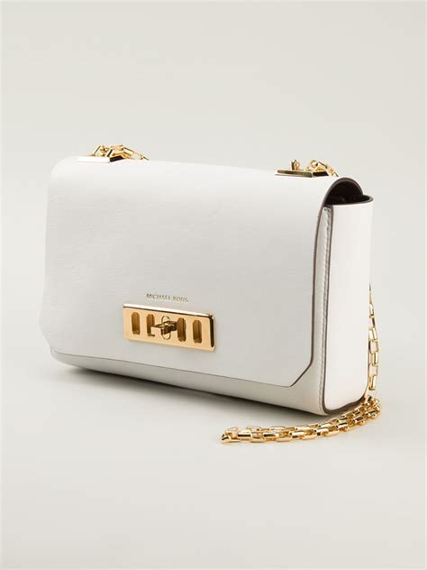 white leather michael kors bag with lock and chain shoulder|Michael Kors flat shoulder handbags.